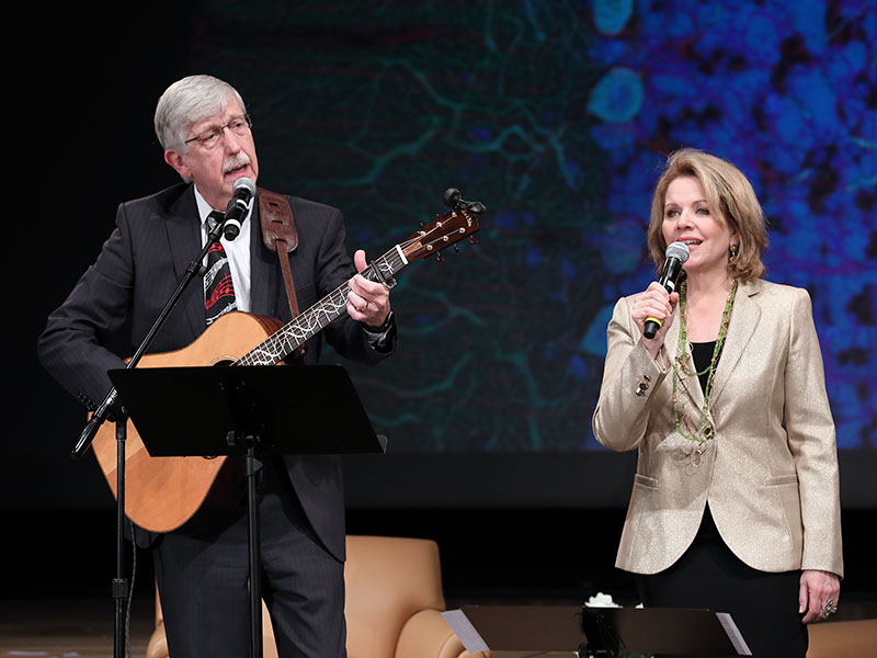 NIH Director Francis Collins playing guitar and singing with Renee Fleming