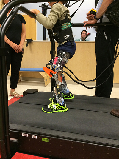 child walking with legs in the exoskeleton