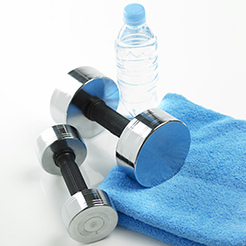 Bar bells, water bottle, and gym towel