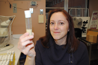 Susan Harbison holding a test tube