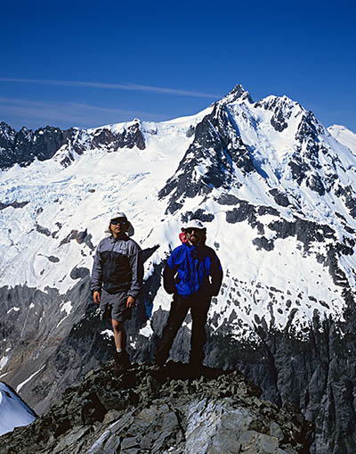 two men on a snow-covered mountaintop