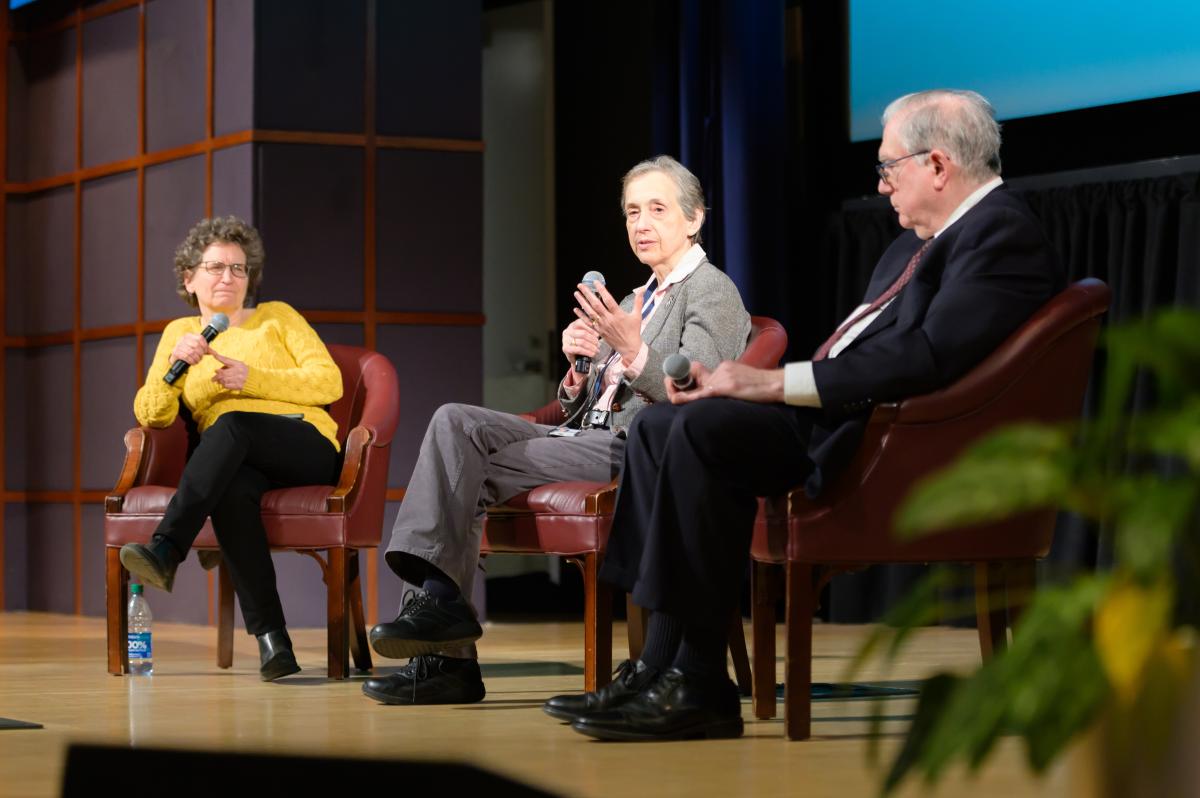 NIH leaders sitting on a stage
