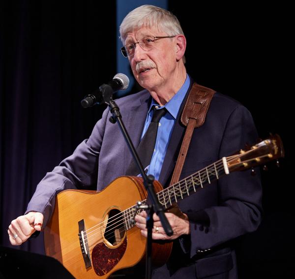 Francis Collins playing his guitar