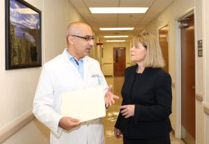 Dr. Janet Hall talking with Dr. Stavros Garantziotis