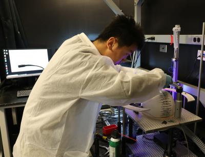 graduate student Kai Zhang sets up the virtual reality training rig for the mice used in Dr. Gu's experiments
