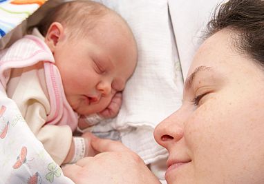 mother and baby sleeping next to each other