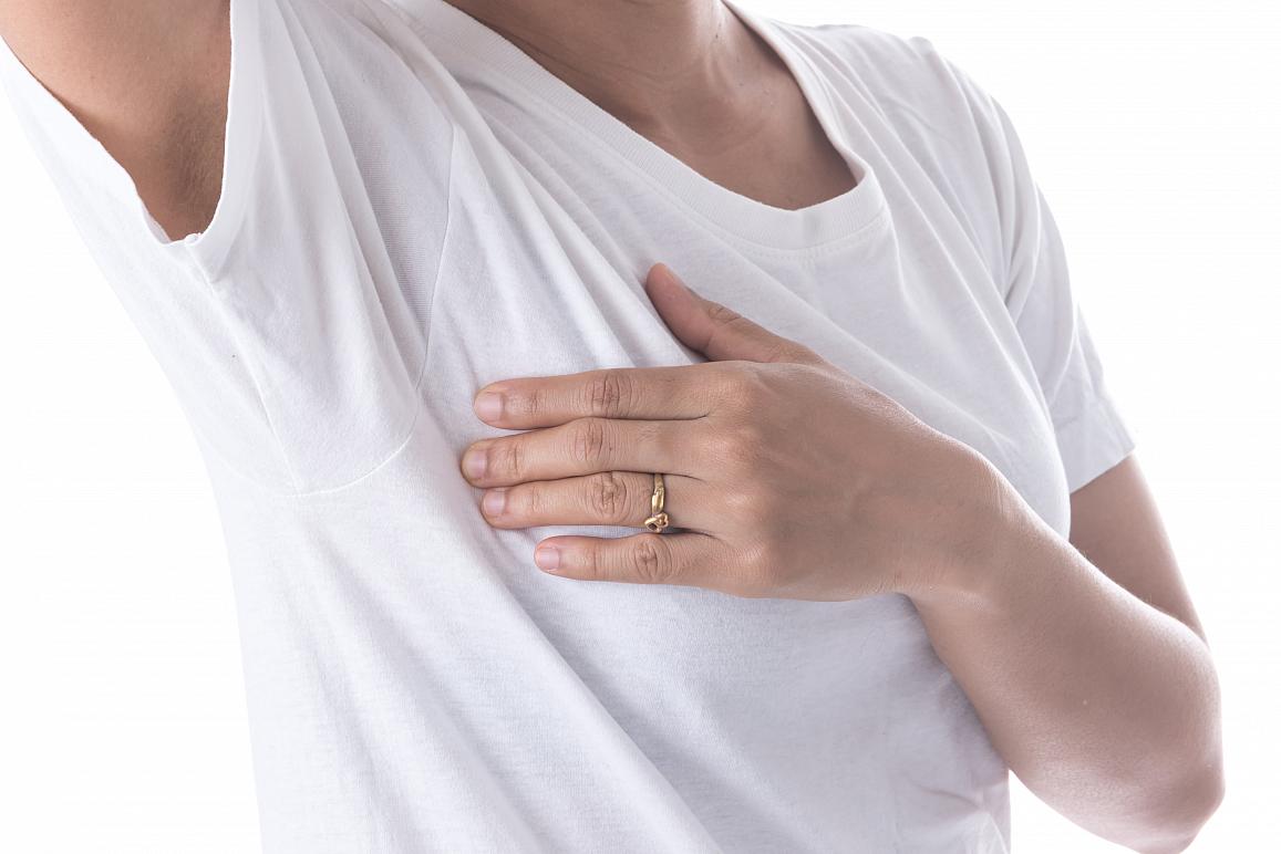 woman doing a self-exam for breast cancer