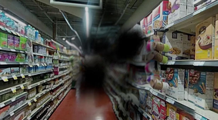 A simulation showing what a grocery store aisle looks like to someone with age-related macular degeneration
