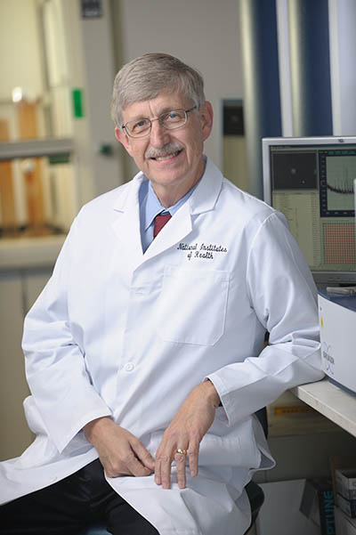 Francis Collins in a lab coat, in his lab
