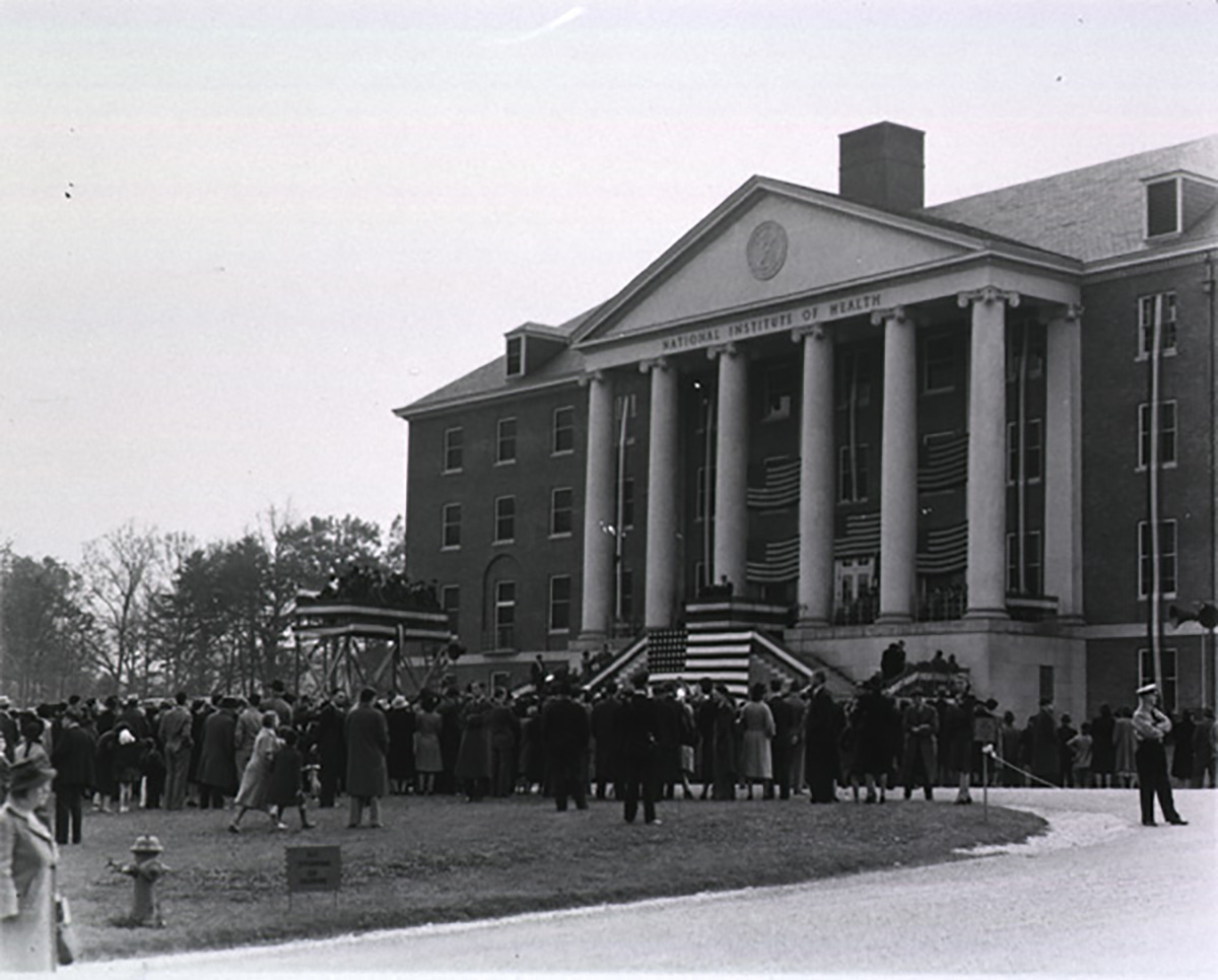 crowd listening to dedication of NIH's campus