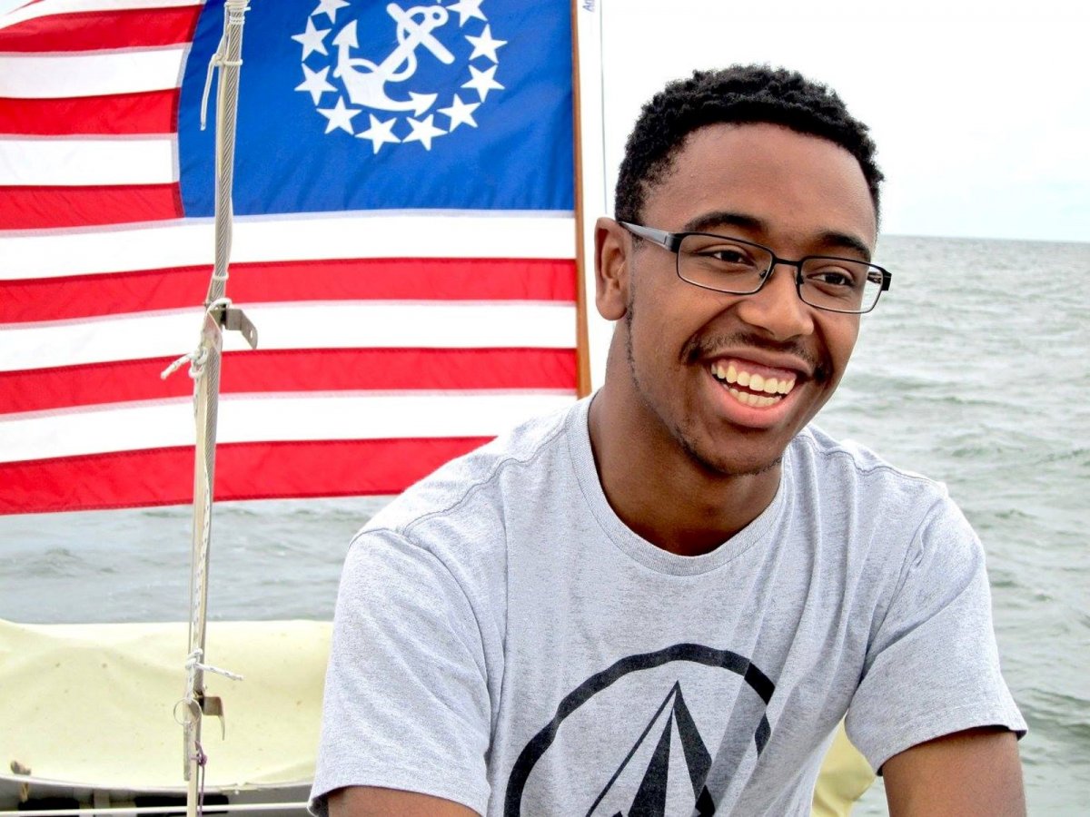 Photo of Aaron smiling on a boat