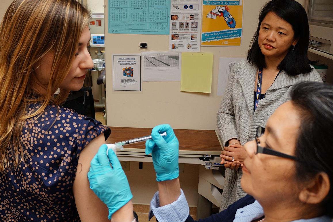 A healthy volunteer receives an experimental universal influenza vaccine known as H1ssF_3928 as part of a Phase 1 clinical trial at the NIH Clinical Center in Bethesda, Maryland.