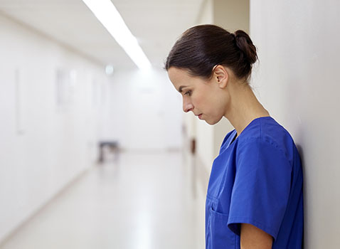 healthcare worker looking sad