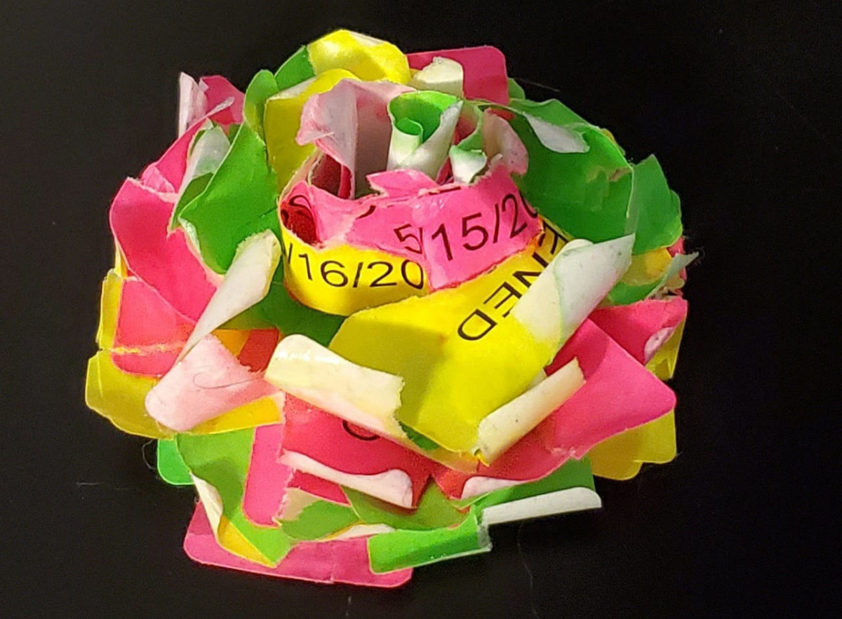 a flower made out of medical screening tags