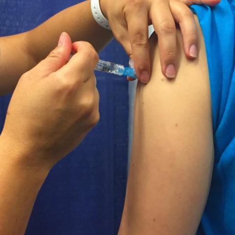 person receiving a flu shot