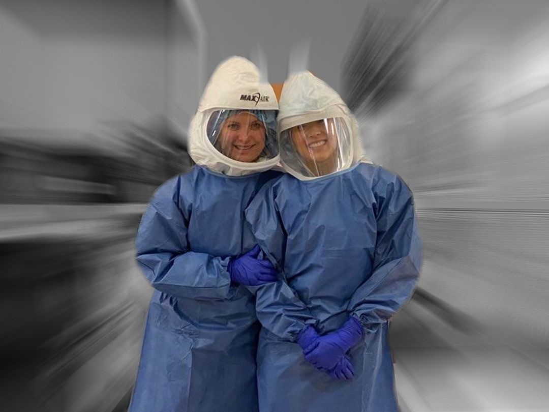 two nurses wearing personal protective equipment (PPE)