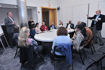 People sitting at round tables and talking.