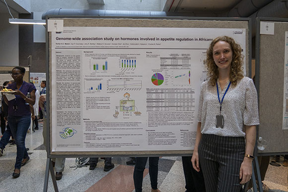 Karlijn Meeks standing next to her poster