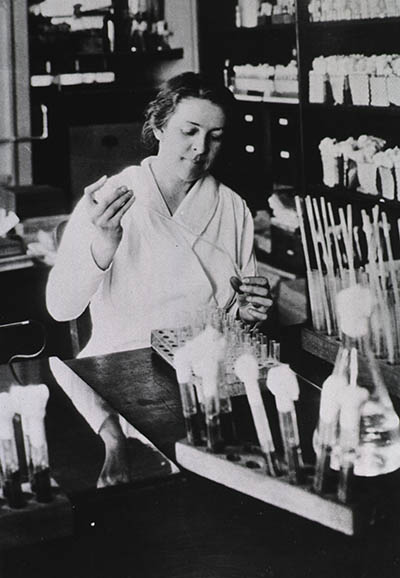 Black and white photo of Alice Evans working in a lab