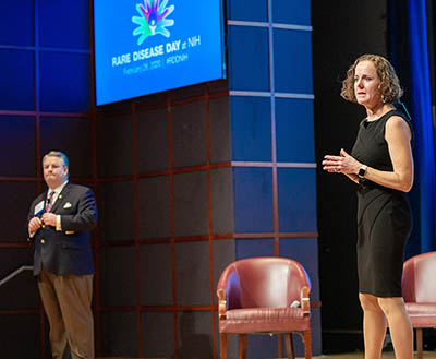 Chip Chambers and Amanda Ombrello on stage at the Rare Disease Day conference