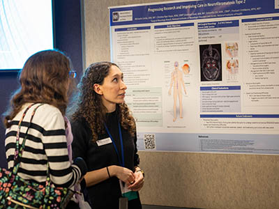 two women at a poster.