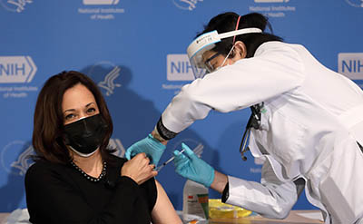 kamala harris, wearing a mask, getting the covid vaccine