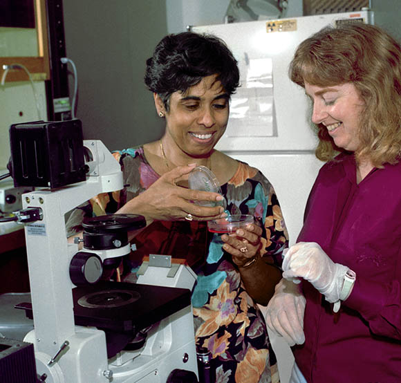  shayamala harris and a female colleague in a lab