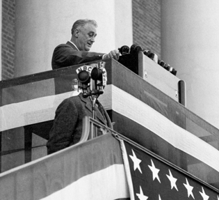 president roosevelt at podium in front of NIH Building One