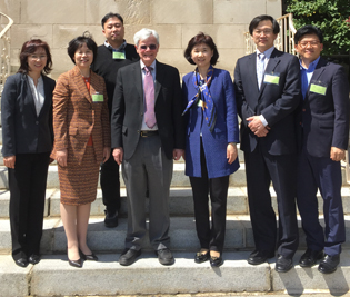 Michael Gottesman and six researchers from South Korea on the steps of Building One