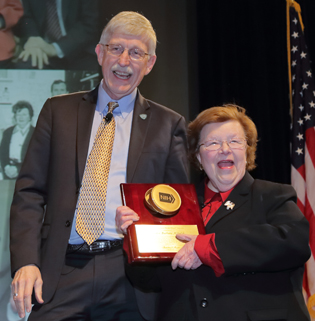 NIH Director Francis Collins and U.S. Senator Barbara Milkulski with Mikulski holding the plaque.
