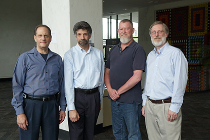 Four men standing