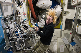 Kate Rubins in a lab aboard the International Space Station.