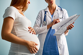 pregnant woman talking to health-care provider
