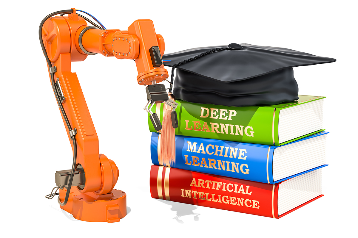robot arm and books stacked up--Machine Learning, Deep Learning, and Artificial Intelligence. Graduation cap sitting on top of pile of books