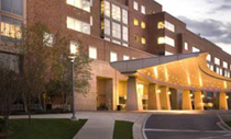 photo of exterior of Clinical Center's north entrance at night