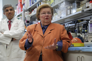 Barbara Mikulski (foreground) and Ramaprasad Srinivasan in a lab.