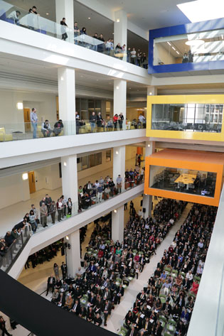People line the balconies in the 4-story atrium