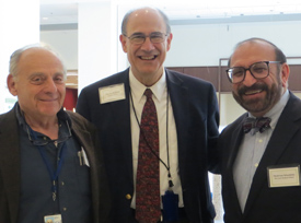 three men, including Mark Hallett who is in the middle