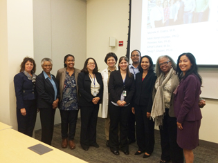 group of women standing in a conference room