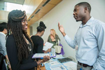  Johnetta Saygbe (left) talking to one of the recruiters