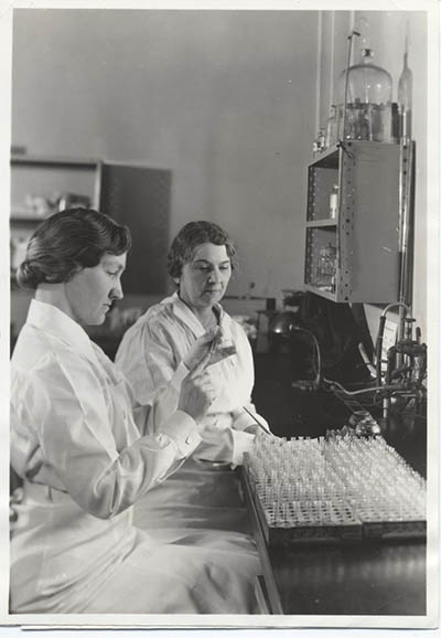two women sitting in a lab