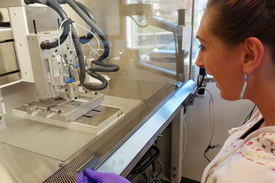 scientist using a 3D printer