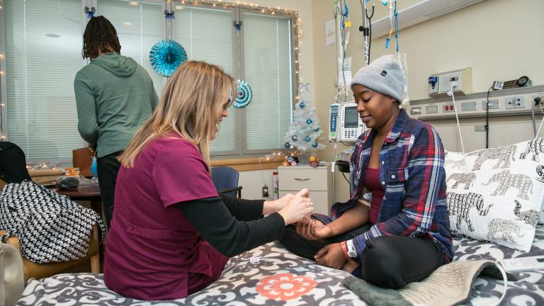 a black patient with sickle cell diseases receives treatment