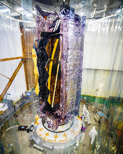 Webb telescope, folded, in protective tent