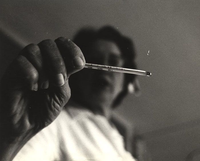 nurse holding thermometer