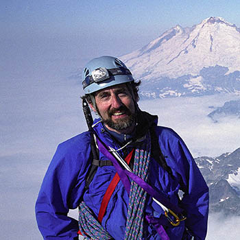 man on snow-covered mountaintop