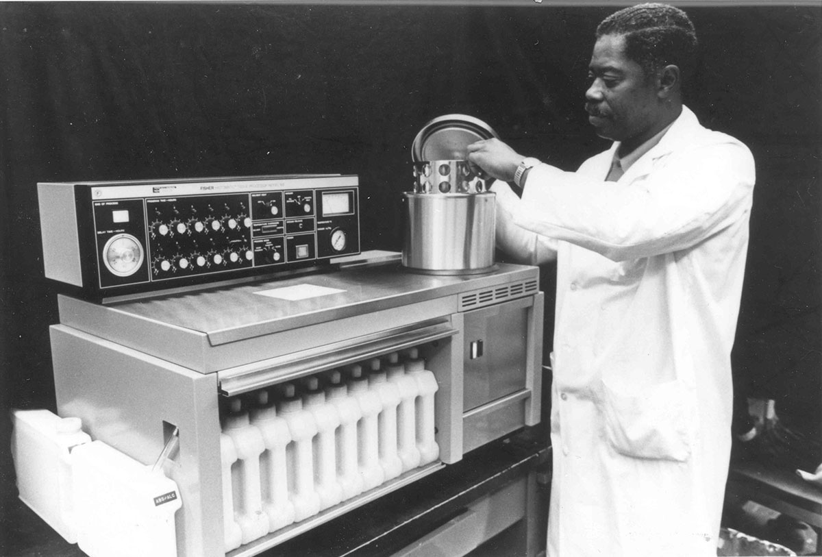 scientist performing tissue pathology in a lab