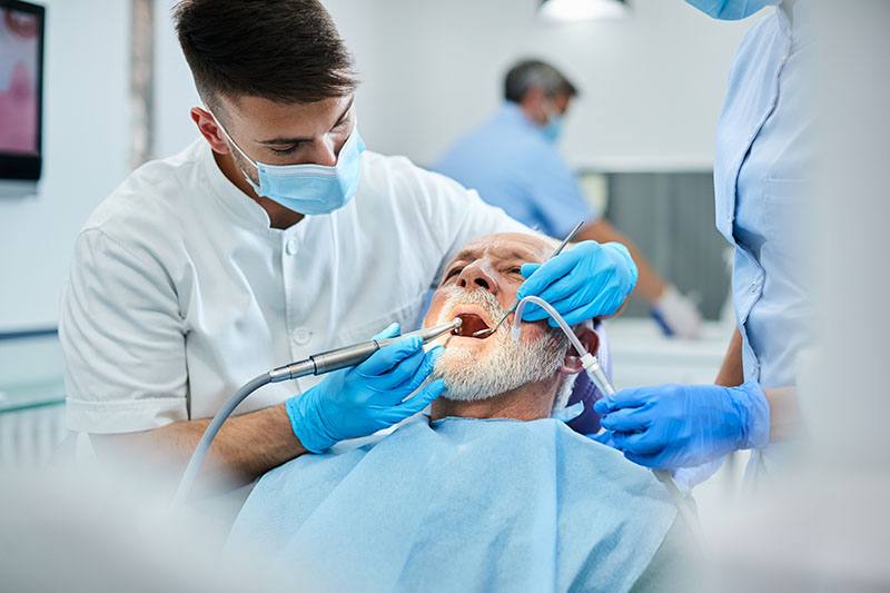 dentist working on a patient's teeth