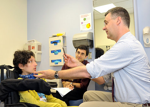 Carsten G. Bönnemann works with a child who has a rare form of ALS