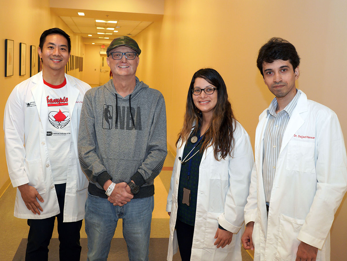 a patient named Aaron (second from left) poses with a group of clinical fellows from NIH’s Department of Transfusion Medicine